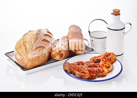 Freshly baked crusty homemade butter rolls and baked bread isolated on white background, traditional Bulgarian breakfast Stock Photo