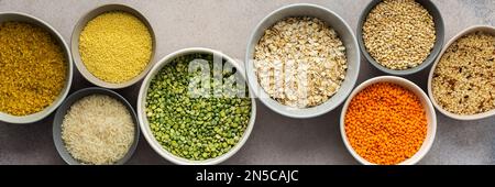 Various grain cereals in bowls banner, top view Stock Photo