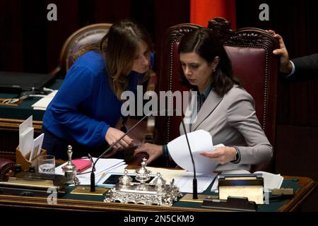 Relations with Parliament Minister Maria Elena Boschi, left, talks with Lower Chamber spokeswoman Laura Boldrini prior to a confidence vote in the Chamber of Deputies, in Rome, Tuesday, Feb. 25, 2014. The Senate voted 169-139 to confirm Premier Matteo Renzi's broad coalition, which ranges from his center-left Democrats to center-right forces formerly loyal to ex-premier Silvio Berlusconi. Renzi needed at least 155 votes to clinch the victory, one of two mandatory confidence votes. The second vote, in the Chamber of Deputies, is expected later Tuesday. Renzi's coalition has a comfortable majori