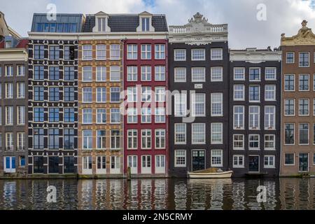 Traditional buildings around the Damrak, Amsterdam Netherlands Stock