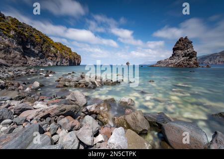 Volcanic bay with a view of the stack and Lipari and Salina in the background, Vulcano Stock Photo