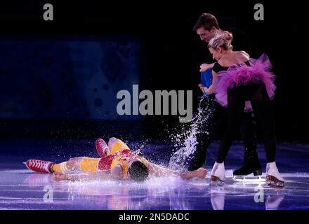 Javier Fernandez of Spain is poured water as part of his performance