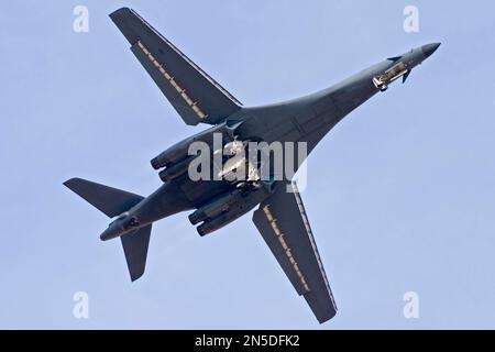 United States Air Force Rockwell B-1B Lancer [86-0133] flying over runway 24. Stock Photo