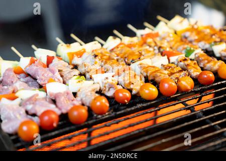 BBQ Grilled Wegetables on Skewers with Fresh Herbs and Spices. Summer Barbecue Food. Stock Photo
