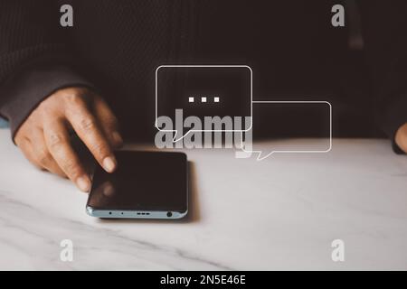 Woman using smartphone typing Live chat chatting and social network concepts, chatting conversation in chat box icons pop up. Social media marketing t Stock Photo