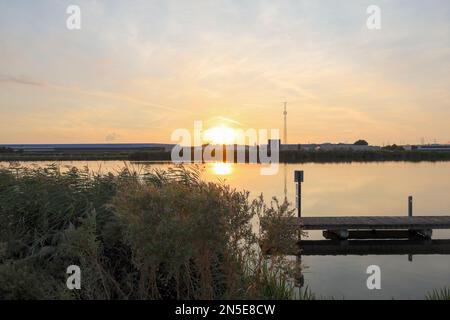 Sunset over river Rotte at the Tweemanspolder in Zevenhuizen in the Netherlands Stock Photo