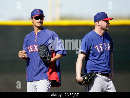 Texas Rangers first baseman Yoshi Tsutsugo, of Japan, runs after a foul  ball during the fifth inning of a spring training baseball game against the  Chicago Cubs Friday, March 24, 2023, in