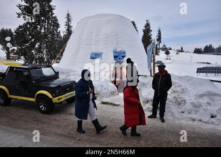 Tourists visit the Igloo cafe in Ski resort Gulmarg, Indian Administered Kashmir on 08 February 2023.An igloo cafe, claimed to be the world's largest, has come up at the famous ski-resort of Gulmarg in Jammu and Kashmir. With a height of 112 Meter (40 feet) and a diameter of 12.8 meter (42 feet), creator of the igloo, claimed it was the world's largest cafe of its kind. It took 20 days to complete it with 25 people working day and night, he said, adding that it took 1,700 man-days to complete the project. (Photo by Mubashir Hassan/Pacific Press/Sipa USA) Stock Photo