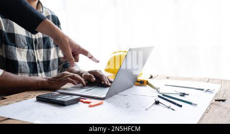 In engineering bureau engineers discussing technical construction Stock Photo