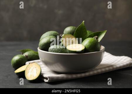 Fresh green feijoa fruits on black table, closeup Stock Photo