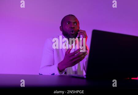 African american man talking on the phone. angry man talking on the phone Stock Photo