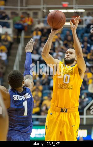 West Virginia's Devin Williams (5) looks to shoot during the second half of  an NCAA college basketball game Monday, Dec. 2, 2013, in Morgantown, W.Va.  West Virginia won 96-47. (AP Photo/Andrew Ferguson
