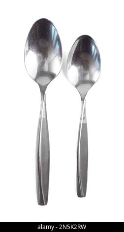 Two Stainless Steal Spoons a Large and Small Isolated on a White Background Stock Photo