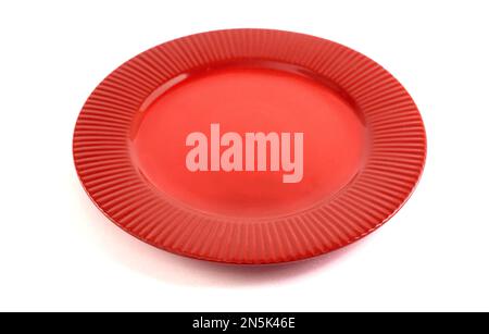 An Empty and Clean Red Plate Isolated on a White Background Stock Photo