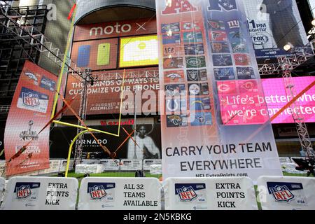 An NFL football is placed on a kicking tee and is ready for the kickoff to  start the play Stock Photo - Alamy