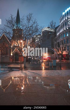 A vertical shot of a path along Suzhou Creek at night in Shanghai, China. Stock Photo