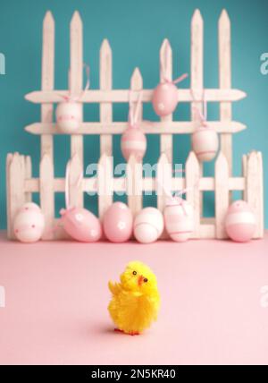 Close up of cute chick with Easter eggs background Stock Photo