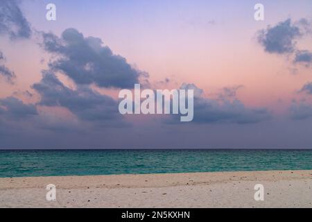 Colourful Sand sea and sky;  Indian Ocean beach landscape just after sunset, the Maldives, Asia. Useful for a background Stock Photo