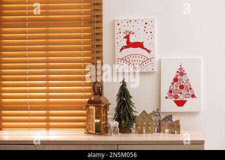 Beautiful Christmas pictures in decorated room. Interior design Stock Photo