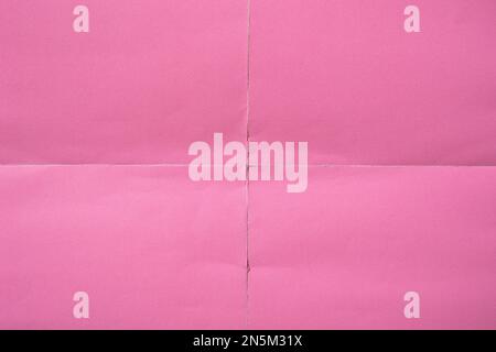 Pink paper background with creases that separates paper into four parts Stock Photo