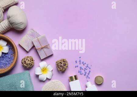 Flat lay composition with spa items on violet background. Space for text Stock Photo