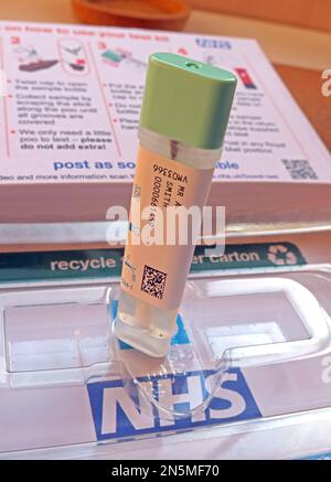 NHS bowel cancer screening programme, poo sample ready to be posted, using pre-paid tracked royal Mail envelope Stock Photo