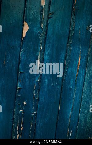 Flaking blue paint on a wooden door. Stock Photo