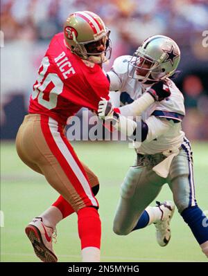 NFL FILE: Jerry Rice (80) and Steve Young (8) of the San Francisco 49ers  during Super Bowl XXIX at Joe Robbie Stadium in Miami, Florida. Young threw  a record 6 touchdowns and