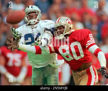 NFL FILE: Jerry Rice (80) and Steve Young (8) of the San Francisco 49ers  during Super Bowl XXIX at Joe Robbie Stadium in Miami, Florida. Young threw  a record 6 touchdowns and