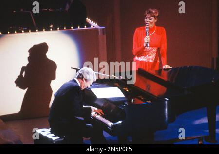 File photo - Burt Bacharach and Dionne Warwick perform during a gala for AIDS sponsored by Dionne Warwick and Showtime at the John F. Kennedy Center for the Performing Arts in Washington, DC on June 12, 1988. - Legendary American pop composer Burt Bacharach has died of natural causes in Los Angeles aged 94. Photo by Ron Sachs/CNP/ABACAPRESS.COM Stock Photo