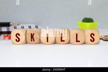 Skills Word Written In Wooden Cube. Stock Photo