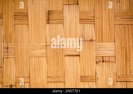 Close up wood texture detail of abstract yellow-brown bamboo stick pattern, Japanese's building material for background, backdrop or design element deco Stock Photo