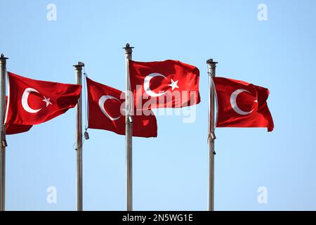 Turkish flags waving on clear blue sky background. National symbol of Turkey Stock Photo
