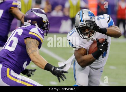 Detroit Lions' Reggie Bush, right, runs past Baltimore Ravens' Terrell  Suggs for a touchdown during the first quarter at Ford Field in Detroit on  Monday, Dec. 16, 2013. (Photo by Karl Merton