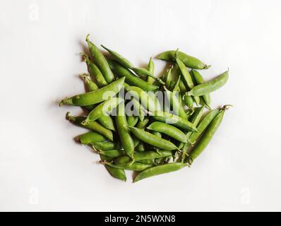 Vegetable Pea in isolated white background. Scientific name - Pisum sativum. Stock Photo