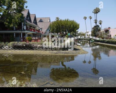 A corrner plot with pedestrian bridge in Venice Canal Historic District, Los Angeles County, USA - May 2015 Stock Photo