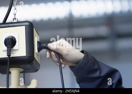 Asian young woman working as engineer, Freiburg im Breisgau, Baden-Württemberg, Germany Stock Photo