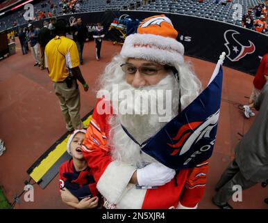 A Denver Broncos fan is seen before the start of an NFL football game  between the Denver Broncos and Kansas City Chiefs Sunday, Dec. 5, 2021, in  Kansas City, Mo. (AP Photo/Charlie