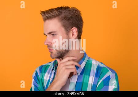 Deep thinker. Thinking man yellow background. Profile of pensive guy. Thinking is good Stock Photo
