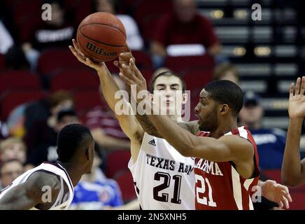 Missouri s Tramaine Isabell left drives past Texas A M s Alex