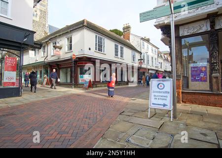 Big Issue seller on a high street in Ipswich, Suffolk, UK Stock Photo