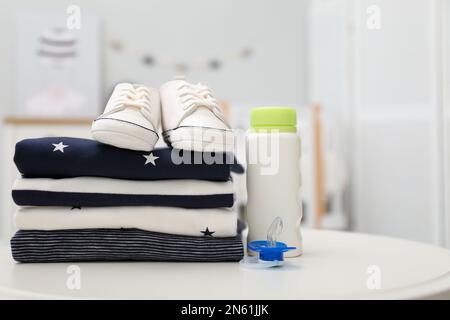 Laundry accessories on white table against blue background Stock Photo by  AtlasComposer