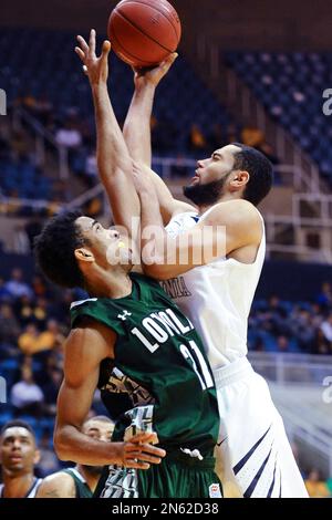 West Virginia's Devin Williams (5) looks to shoot during the second half of  an NCAA college basketball game Monday, Dec. 2, 2013, in Morgantown, W.Va. West  Virginia won 96-47. (AP Photo/Andrew Ferguson