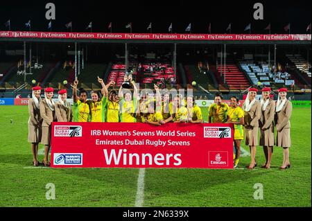 Australia celebrates after defeating New Zealand 35-21 to win the IRB Women's Sevens World Series rugby tournament at the Emirates Dubai Rugby Sevens, Dubai, United Arab Emirates, on Friday, Nov. 29, 2013. (AP Photo/Stephen Hindley)