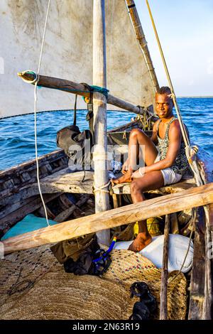 Young man in a traditional sailboat at Lamu Archipelago Kenya Stock Photo