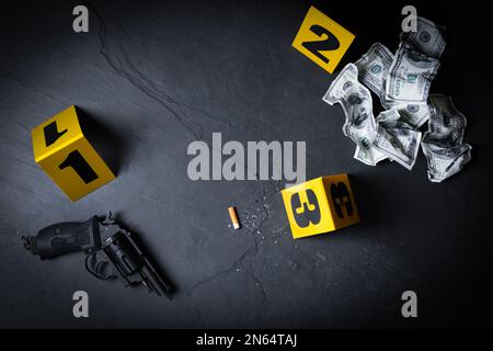 Flat lay composition with evidences and crime scene markers on black background Stock Photo