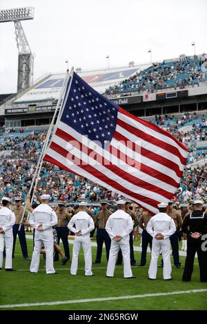 U.S. Military recruits are sworn in during halftime on Salute to Service  military appreciation day at an NFL football game between the Jacksonville  Jaguars and the Las Vegas Raiders, Sunday, Nov. 6