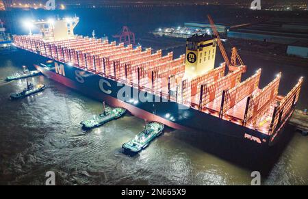 SUZHOU, CHINA - FEBRUARY 10, 2023 - The world's largest newly built container ship 'Xinfu 102' leaves the dock early on the morning of February 10, 20 Stock Photo