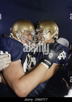 FILE - In this Nov. 13, 1993 file photo, Notre Dame offensive guard Mark  Zataveski, left, and offensive tackle Mike McGlinn celebrate after the  Notre Dame beat Florida State 31-24 in South