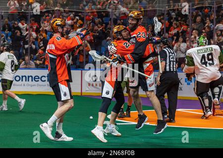 February 4th, 2023: Buffalo Bandits transitional Nick Weiss (20) hugs defenseman Steve Priolo (23) after a goal in the third quarter. The Buffalo Bandits hosted the Rochester Knighthawks in an National Lacrosse League game at KeyBank Center in Buffalo, New York. (Jonathan Tenca/CSM) Stock Photo